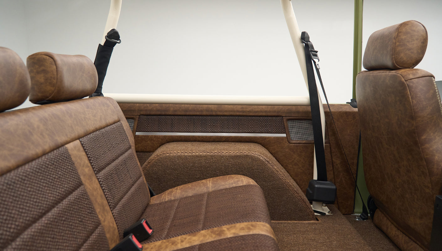 Rear bench seat view with headrest and part of back door interior in Classic Ford Bronco Lime Gold