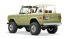 Rear three-quarter view of lime green Classic Ford Bronco showing back and side details