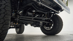 Undercarriage suspension and tires of lifted Classic Ford Bronco truck