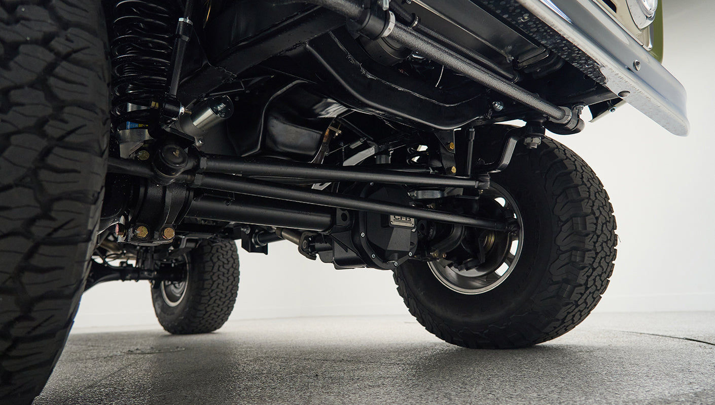 Undercarriage suspension and tires of lifted Classic Ford Bronco truck