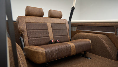 Side angle of rear bench seat with two headrests and seat belts inside Classic Ford Bronco Lime Gold