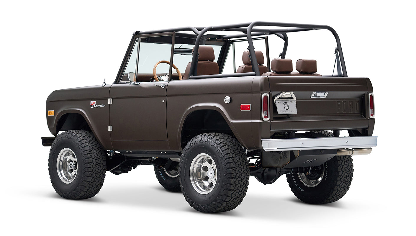 Classic Ford Bronco rear-side view with matte brown paint and open cabin