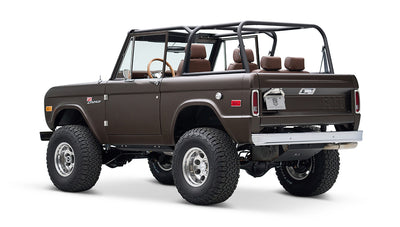 Classic Ford Bronco rear-side view with matte brown paint and open cabin