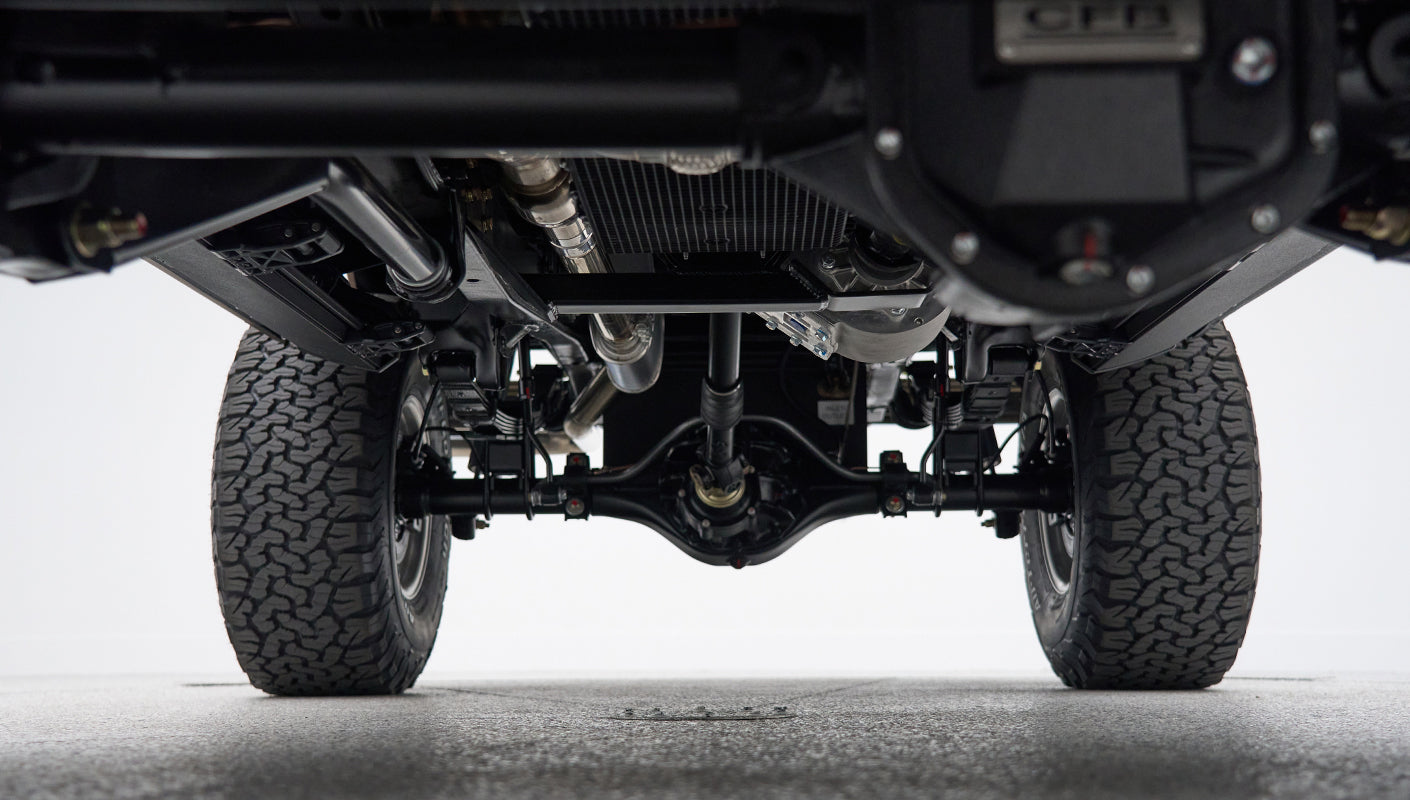 Rear suspension and axle close-up of Classic Ford Bronco with tires visible
