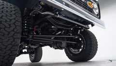 Underneath front suspension and steering components of Classic Ford Bronco with BFGoodrich tires