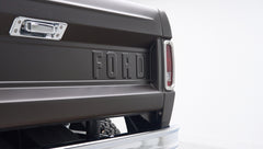Rear matte brown tailgate with embossed FORD lettering and bumper of Classic Ford Bronco