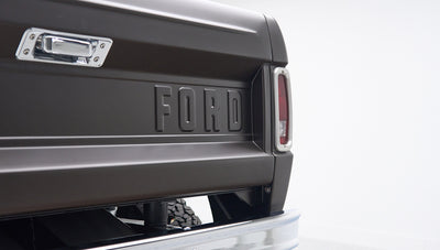 Rear matte brown tailgate with embossed FORD lettering and bumper of Classic Ford Bronco