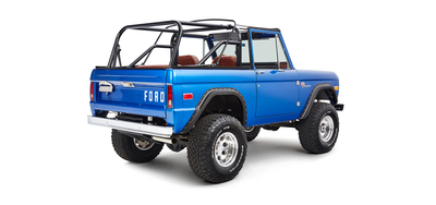 Classic Ford Bronco rear passenger angled view showing tailgate and large off-road tires