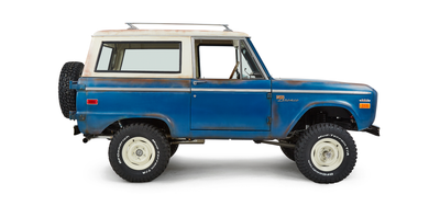 Classic Ford Bronco passenger side profile view showing lifted body and tires