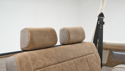 Close-up detail of tan upholstery and headrests in Classic Ford Bronco rear seats