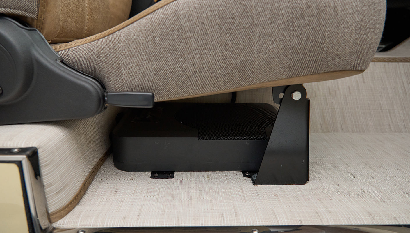 Speaker mounted under the front passenger seat of Classic Ford Bronco