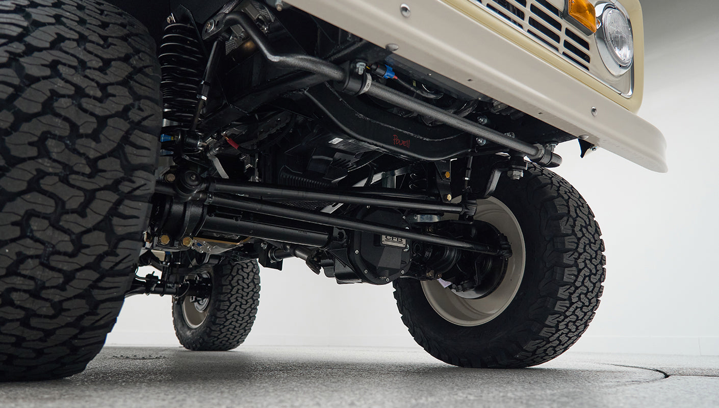 View of the front underside suspension and tires of Classic Ford Bronco