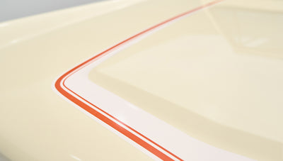 Detail of cream-colored hood with Phoenician stripes in red and white on Classic Ford Bronco