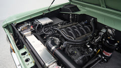 Detailed view of Classic Ford Bronco engine components including Wilwood and PSC parts