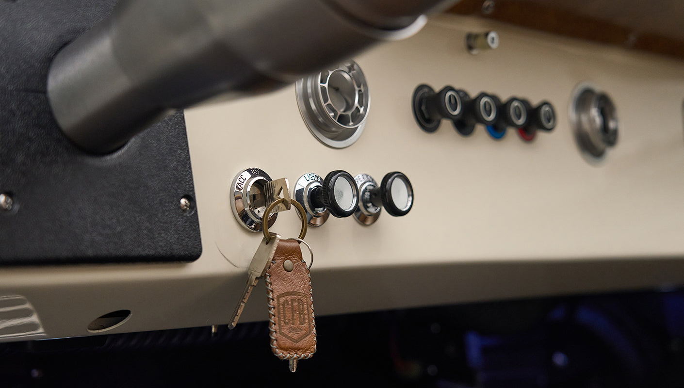 Close-up of dashboard controls with keychain hanging on ignition in Classic Ford Bronco