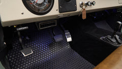 Black and white round speedometer and dashboard switches with ignition key in Classic Ford Bronco