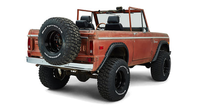 Rear passenger angled view of Classic Ford Bronco with spare tire on back