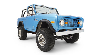 Sky blue Classic Ford Bronco front three-quarter view with off-road tires