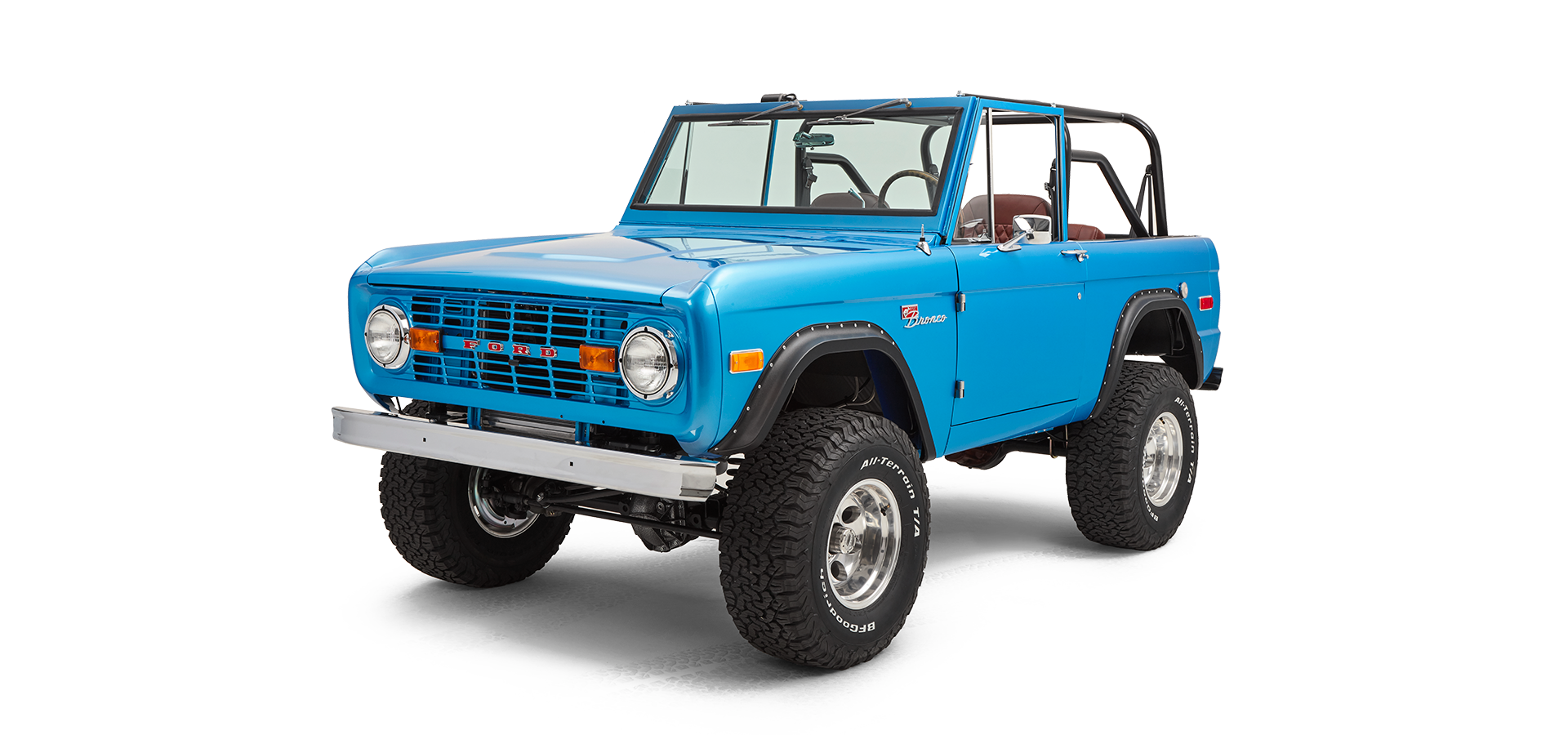 Three-quarter front view showing driver side of sky blue Classic Ford Bronco without roof and front bumper