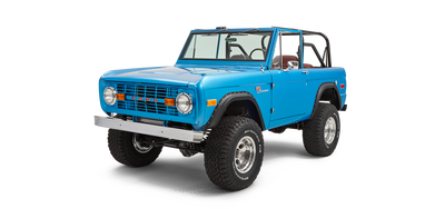 Three-quarter front view showing driver side of sky blue Classic Ford Bronco without roof and front bumper