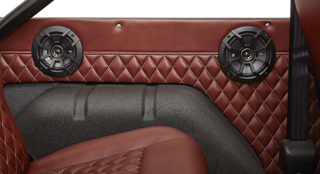 Brown leather diamond-stitched side panel with speakers inside Classic Ford Bronco
