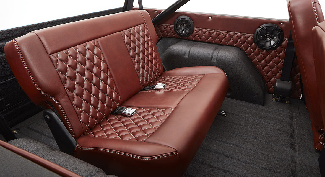 Brown leather rear bench seat with diamond stitching inside Classic Ford Bronco