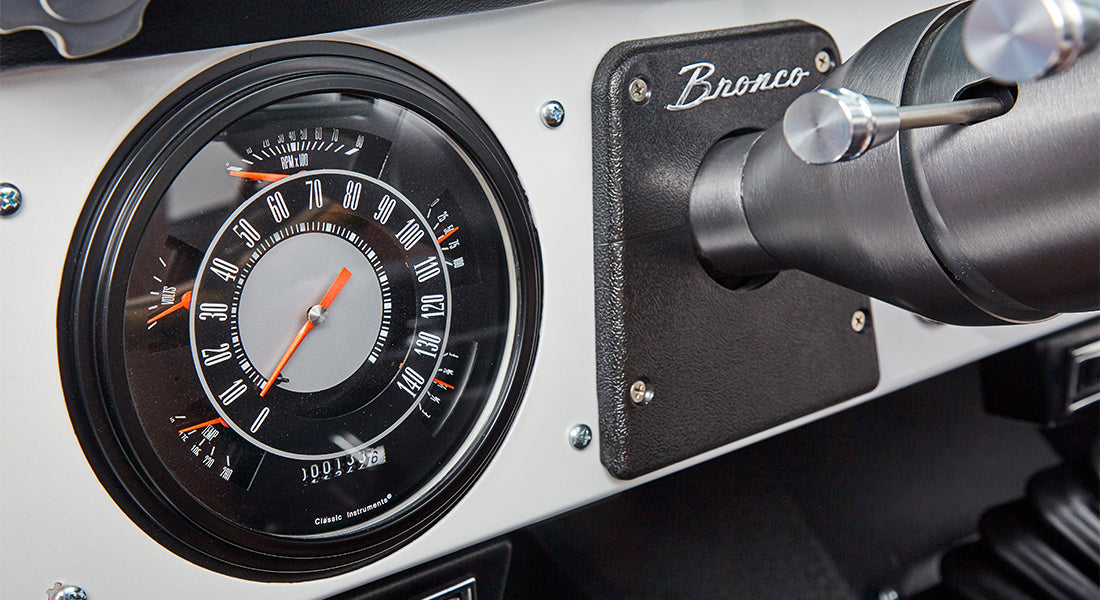 Classic Ford Bronco speedometer and tachometer with black and silver dial and Bronco emblem