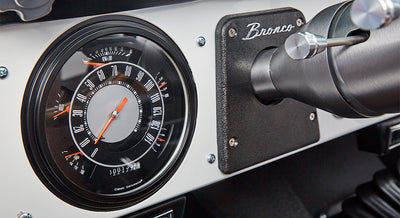 Classic Ford Bronco speedometer and tachometer with black and silver dial and Bronco emblem