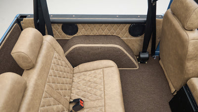 Rear tan quilted seat and speaker in Classic Ford Bronco