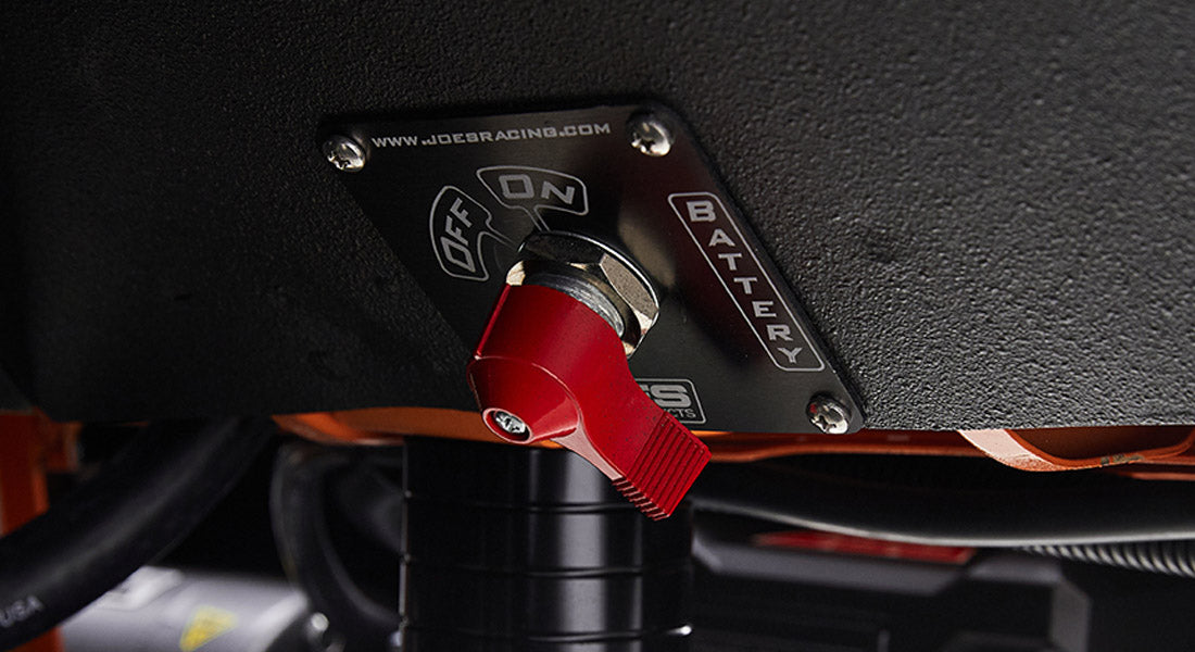 Red toggle switch and black panel labeled Off, On, Battery with visible text