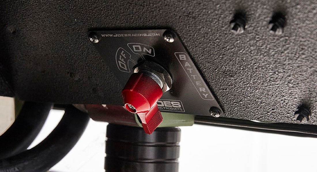 Battery tender switch with red toggle mounted under vehicle