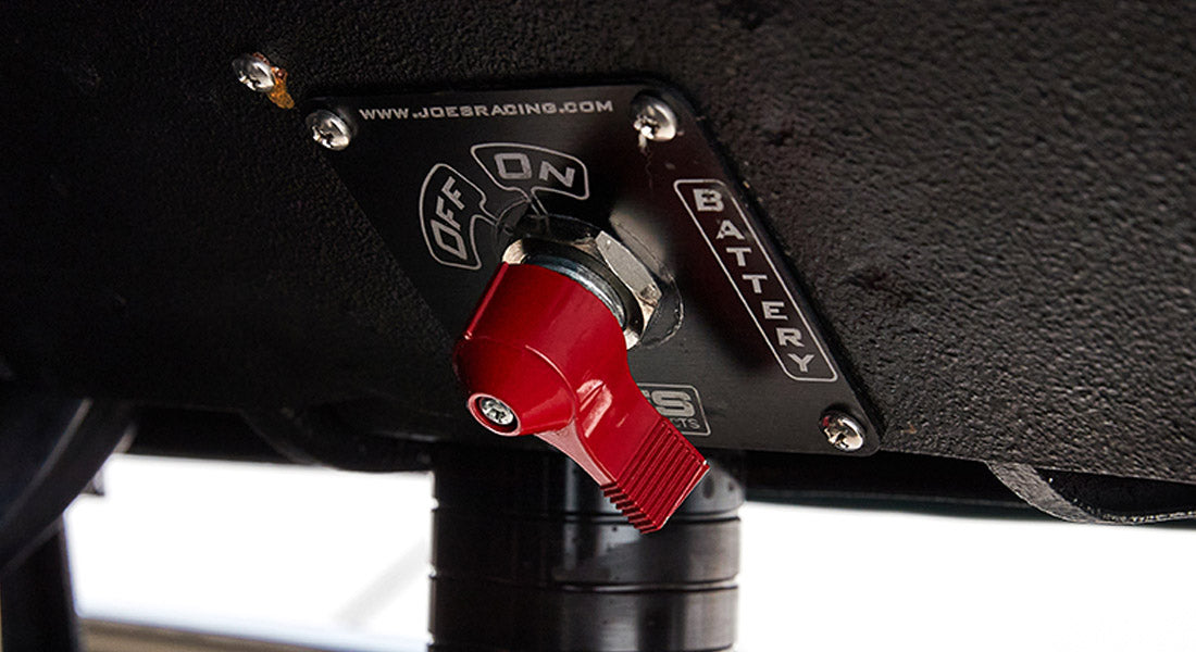Battery disconnect switch with red handle mounted inside Classic Ford Bronco.