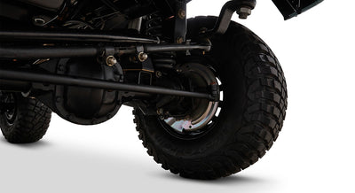 Close-up of Classic Ford Bronco brake assembly and tire from underneath vehicle