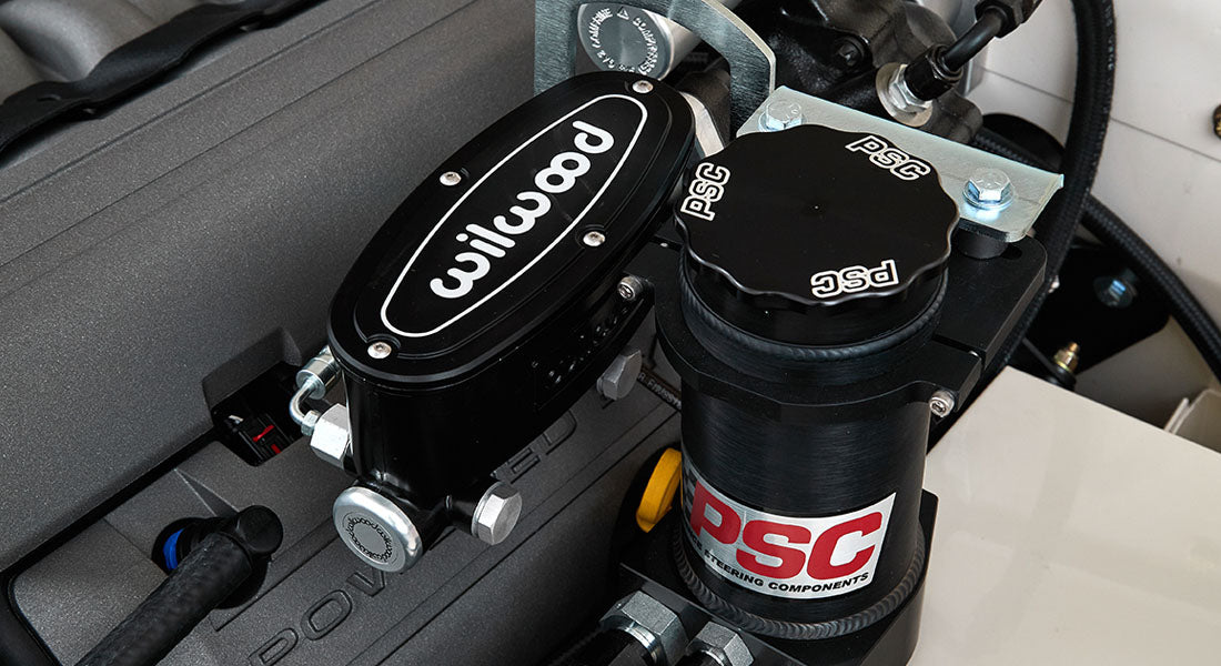 Engine compartment showing black Wilwood and PSC branded brake components