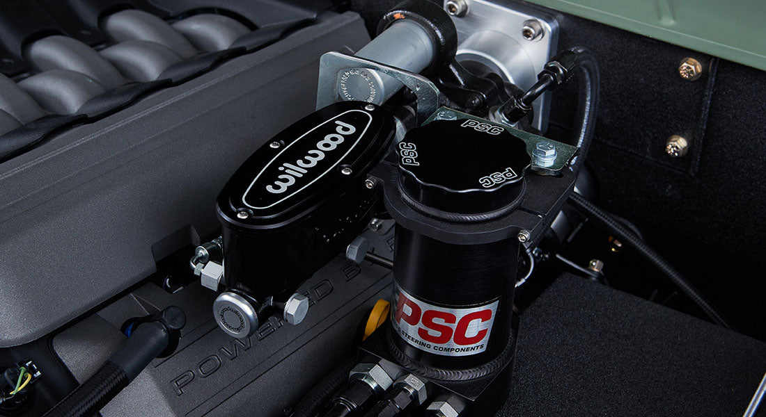 Close-up of black Wilwood brake component and PSC steering components in Classic Ford Bronco engine compartment