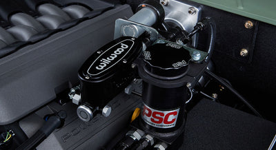 Close-up of black Wilwood brake component and PSC steering components in Classic Ford Bronco engine compartment
