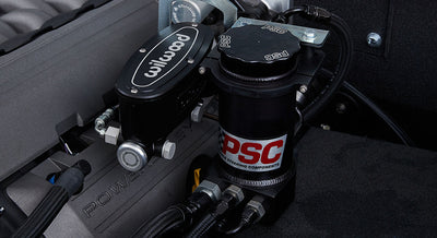 Close-up of black Wilwood component and PSC power steering parts in Classic Ford Bronco engine compartment