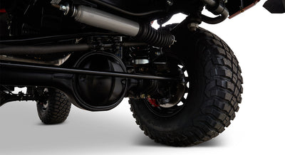 Underside view of Classic Ford Bronco with visible suspension and brake assembly on large tire