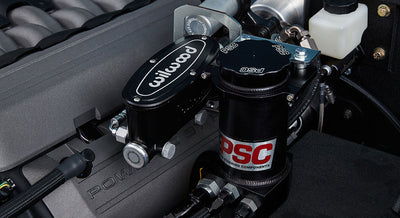 Close-up of black Wilwood and PSC power steering components in a Classic Ford Bronco engine bay