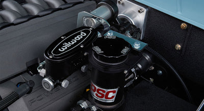Close-up of Wilwood brake component and PSC steering parts in engine bay of Classic Ford Bronco.