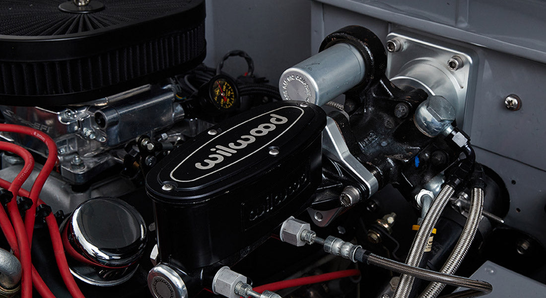 Close-up of Classic Ford Bronco brake master cylinder and engine compartment components
