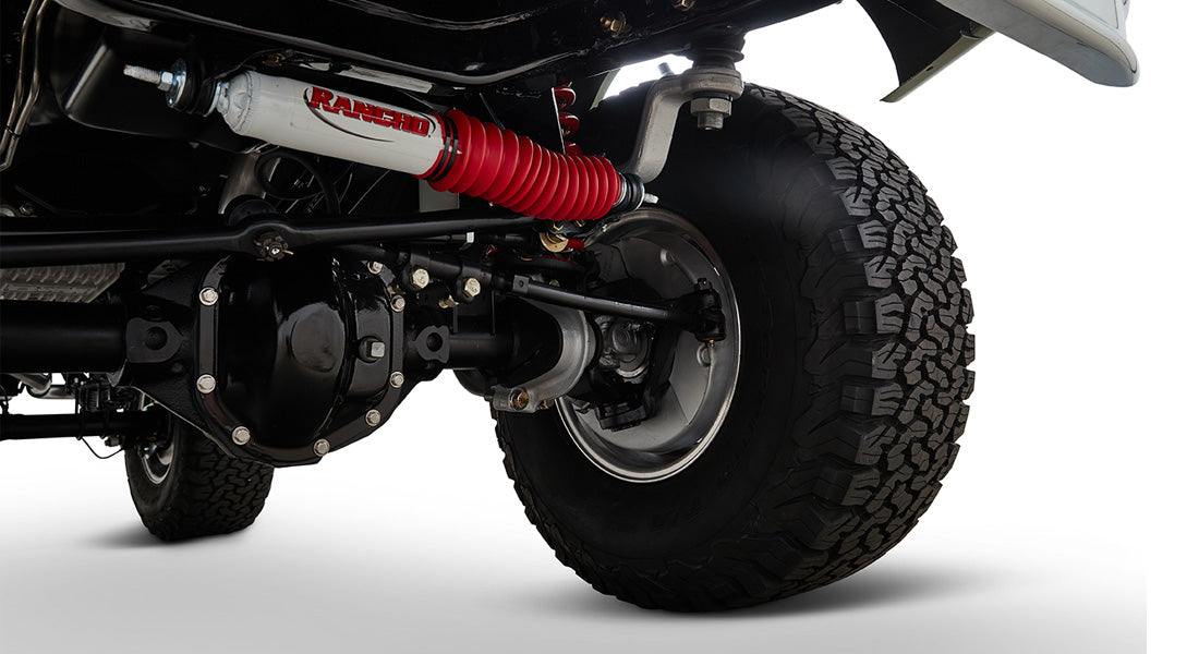 Close-up of Classic Ford Bronco rear suspension and Rancho branded shock absorber