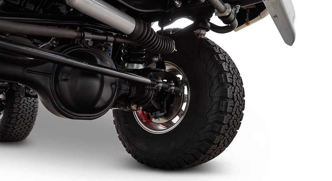 Undercarriage view of Classic Ford Bronco suspension and wheel with tire