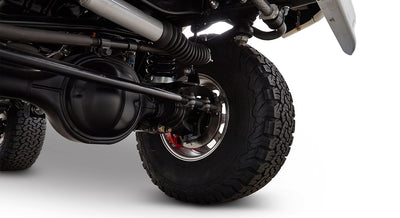 Undercarriage view of Classic Ford Bronco suspension and wheel with tire