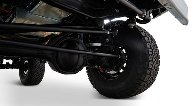 Close-up of suspension and large tire on Classic Ford Bronco viewed from below
