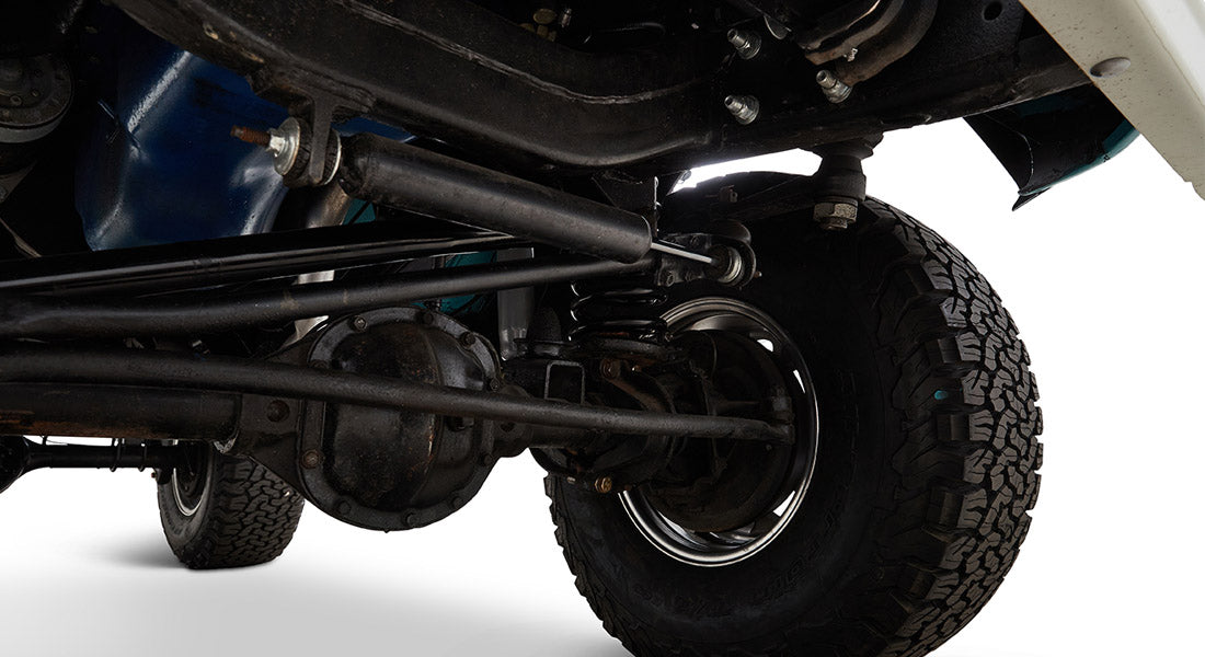 Close-up of Classic Ford Bronco brake system and tire from underneath