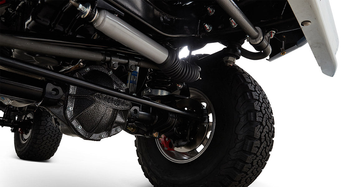 View of front suspension and tire of Classic Ford Bronco from below