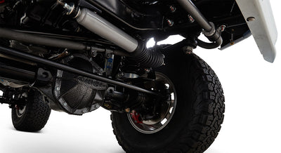 View of front suspension and tire of Classic Ford Bronco from below