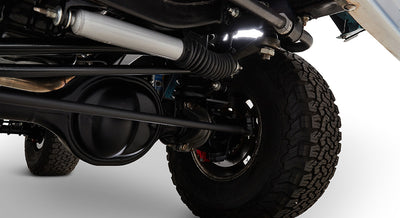 Close-up of the suspension and wheel assembly under Classic Ford Bronco