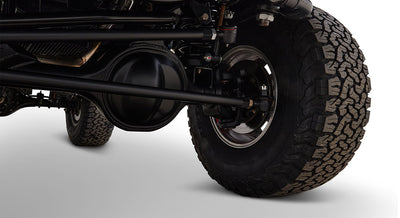 Undercarriage view showing axle, suspension, and tire of Classic Ford Bronco